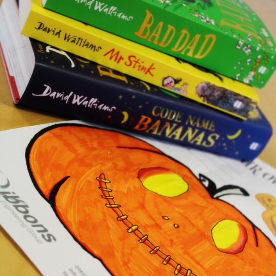 orange pumpkin and books